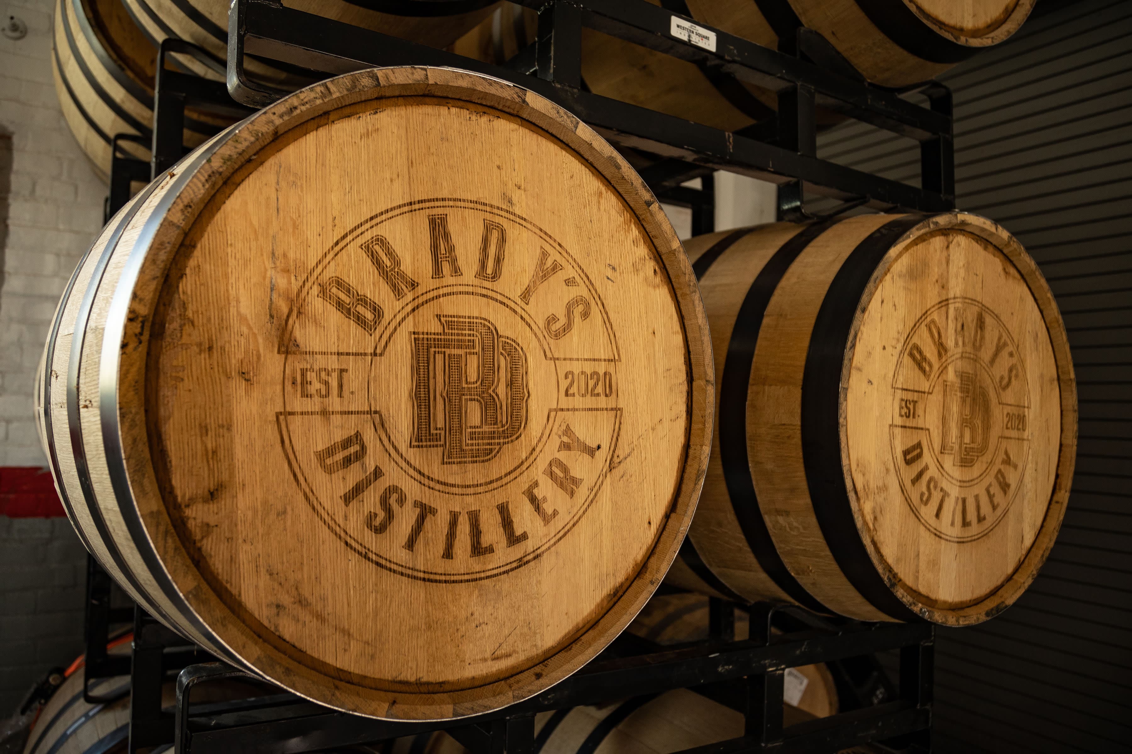 Bourbon barrels aging at Brady's Distillery